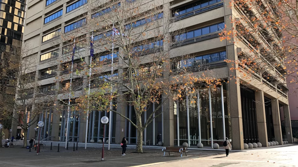 A day at Boettcher Law: The Litigation Lawyer passionately presenting a case, in the courtroom packed with anticipation. The room radiates the powerful pursuit of justice, an everyday scene at Boettcher Law.